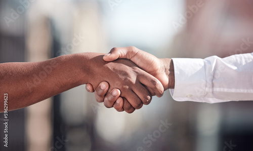 Lets collaborate. Cropped shot of two unrecognizable businessmen shaking hands outside.