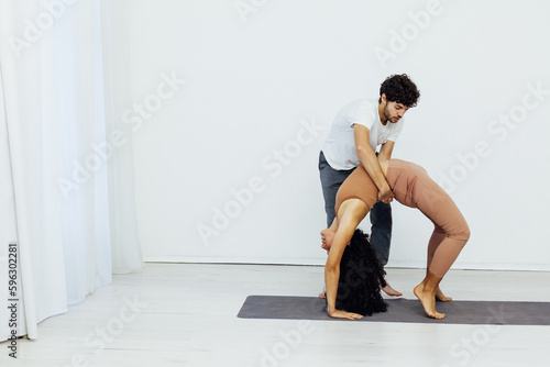 man and woman do gymnastics warm-up yoga asana posture exercises