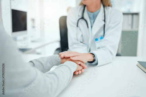 Ill be with you every step of the way. Cropped shot of an unrecognisable doctor sitting and comforting her patient in her clinic.