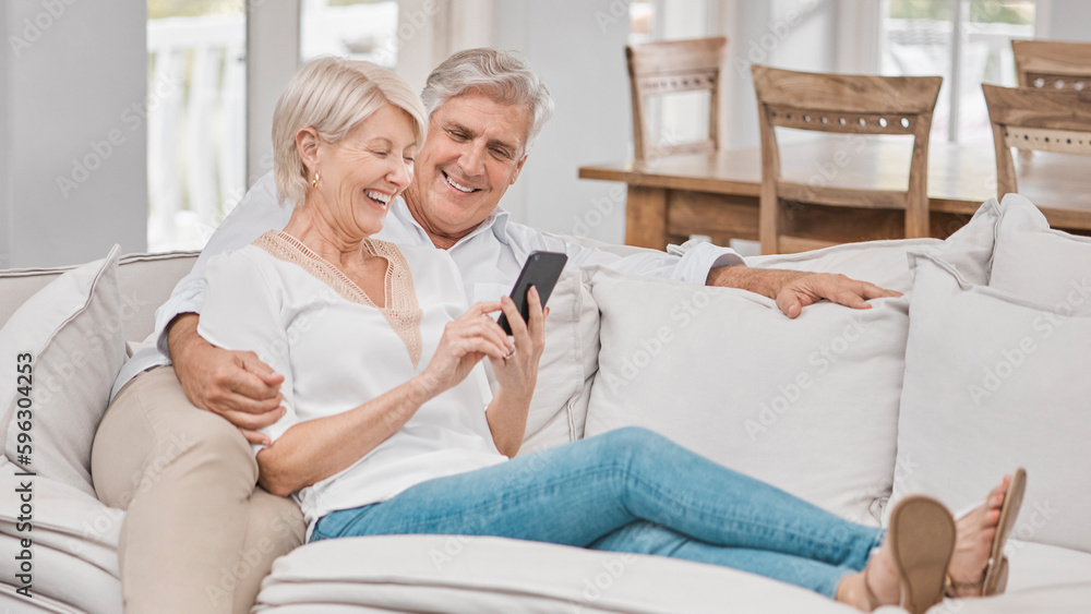 Together is my favorite place to be. Shot of a elderly couple using a cellphone at home. Together is my favorite place to be. Shot of a elderly couple using a cellphone at home.