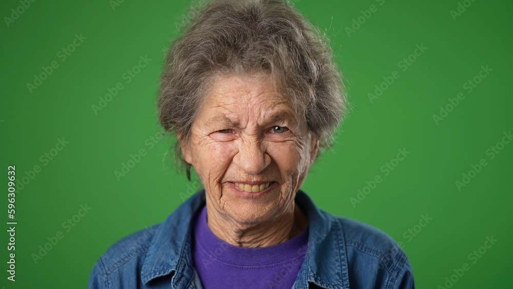 Angry with despair upset funny portrait of elderly mature old woman 80s isolated on green screen background. Angry with despair upset funny portrait of elderly mature old woman 80s isolated on green screen background.