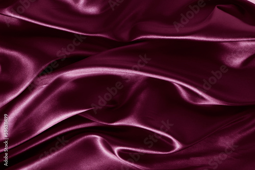 Silk fabric, abstract wavy vinous satin fabric background.