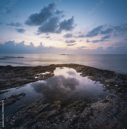 sea sunset and rocks dramatic evening sky and magical light reflected in the sea water coast nature of thailand phuket kaolak