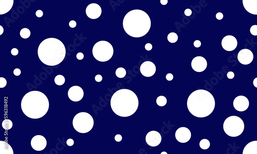 Abstract white random polka dot circles seamless pattern on blue background