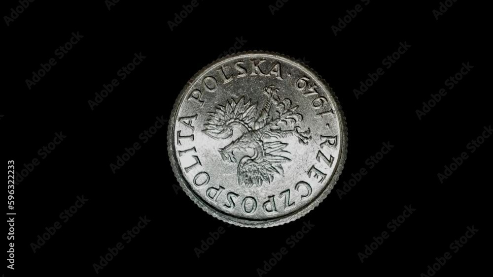 Obverse of Poland coin from 1949 isolated in black background. 4k video Obverse of Poland coin from 1949 isolated in black background. 4k video