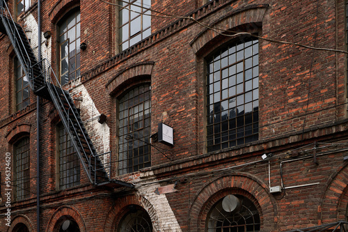 Old historic abandoned red brick halls of former textile factories in Poland