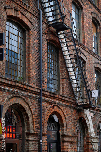 Old historic abandoned red brick halls of former textile factories in Poland