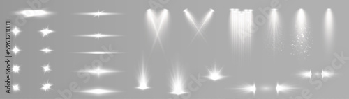 Set of white light spotlights, flashes of light on a transparent background. Vector glowing light effect. photo
