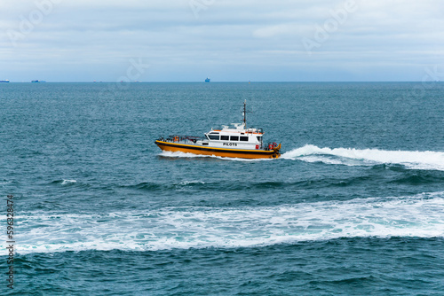 Pilot offshore ship at sea in motion.