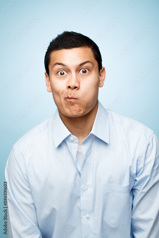Be silly while you can. Shot of a young man making facial expressions against a studio background. Be silly while you can. Shot of a young man making facial expressions against a studio background.