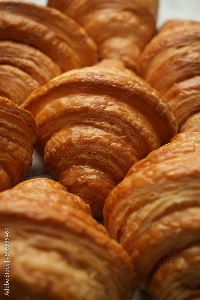 Fototapeta premium Fresh croissant background, close-up.