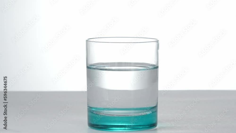 Hangover remedy pill bubbling in water, headache medical treatment. Vitamin C daily dose to be healthy. Hangover remedy pill bubbling in water, headache medical treatment. Vitamin C daily dose to be healthy.