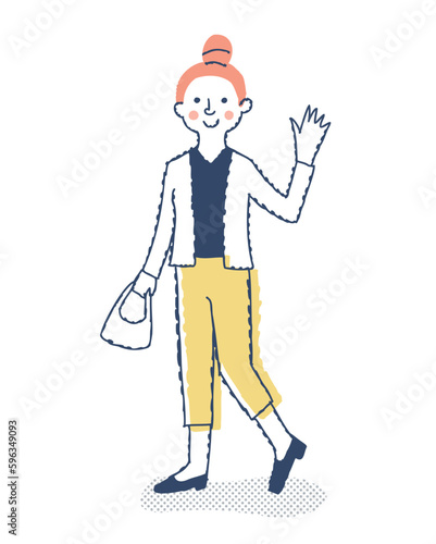 笑顔で手を振る若い女性