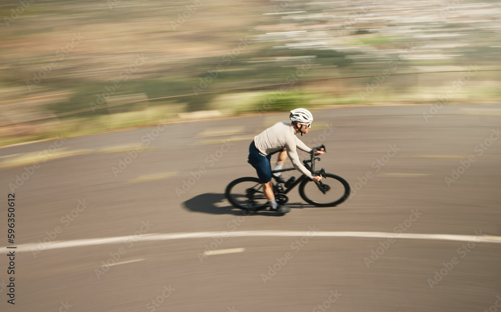 Ripping up the road. High angle shot of a handsome mature man cycling outdoors.