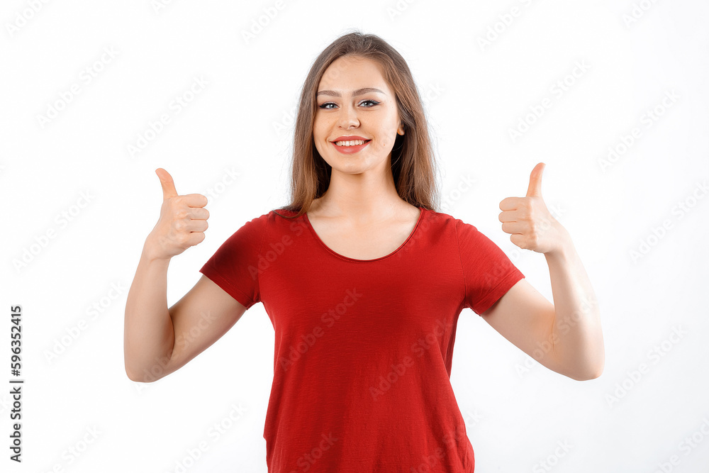 Good job. Satisfied beautiful caucasian girl shows thumbs up, smiling broadly, optimistic assured gaze camera, standing white background Good job. Satisfied beautiful caucasian girl shows thumbs up, smiling broadly, optimistic assured gaze camera, standing white background