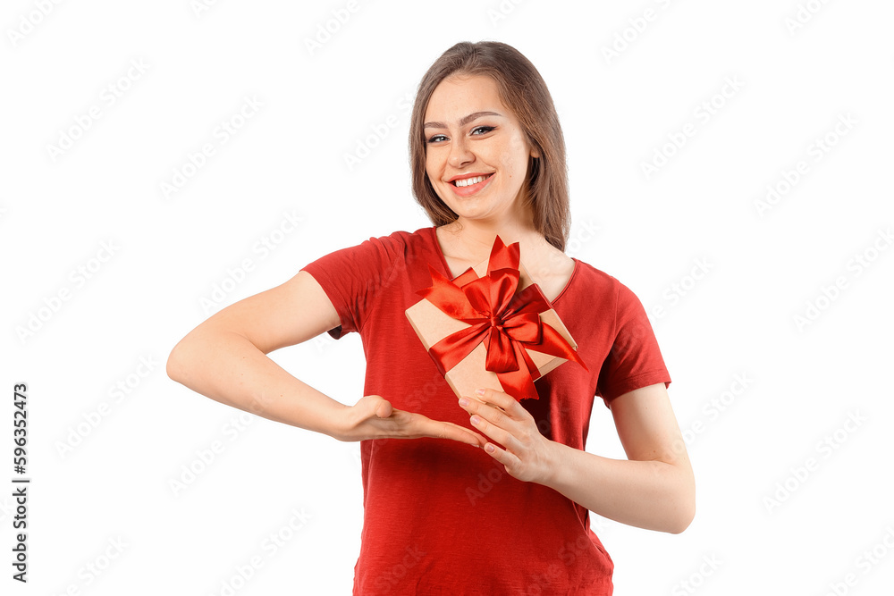 Portrait of a happy smiling girl in red t shirt holding present box and posing over white background. Cheerful brunette woman with long hair smiles, laughs and looks with joy Portrait of a happy smiling girl in red t shirt holding present box and posing over white background. Cheerful brunette woman with long hair smiles, laughs and looks with joy