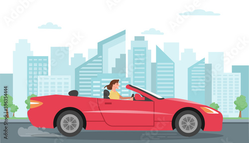 Woman drivging car. Young girl in luxury red transport, expensive cabriolet at background of urban landscape.