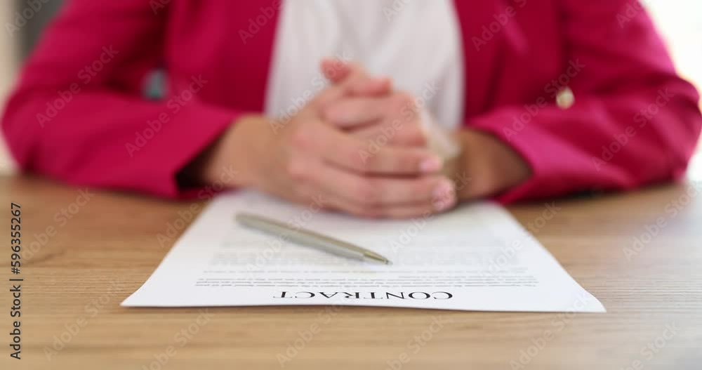 Businesswoman studies information about contract document in office closeup. We draw up extend and conclude contracts Businesswoman studies information about contract document in office closeup. We draw up extend and conclude contracts
