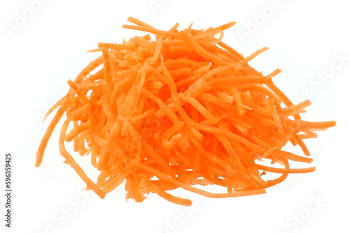 Grated carrots fresh, ripe, orange are ready to eat as salad ingredient or beverage.
