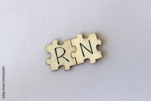 The acronym RN, which stands for Right Now. The letters written on the puzzles.