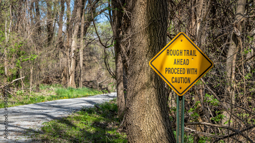 Fotografija rough trail ahead, proceed with caution - warning sign on Steamboat Trace Trail