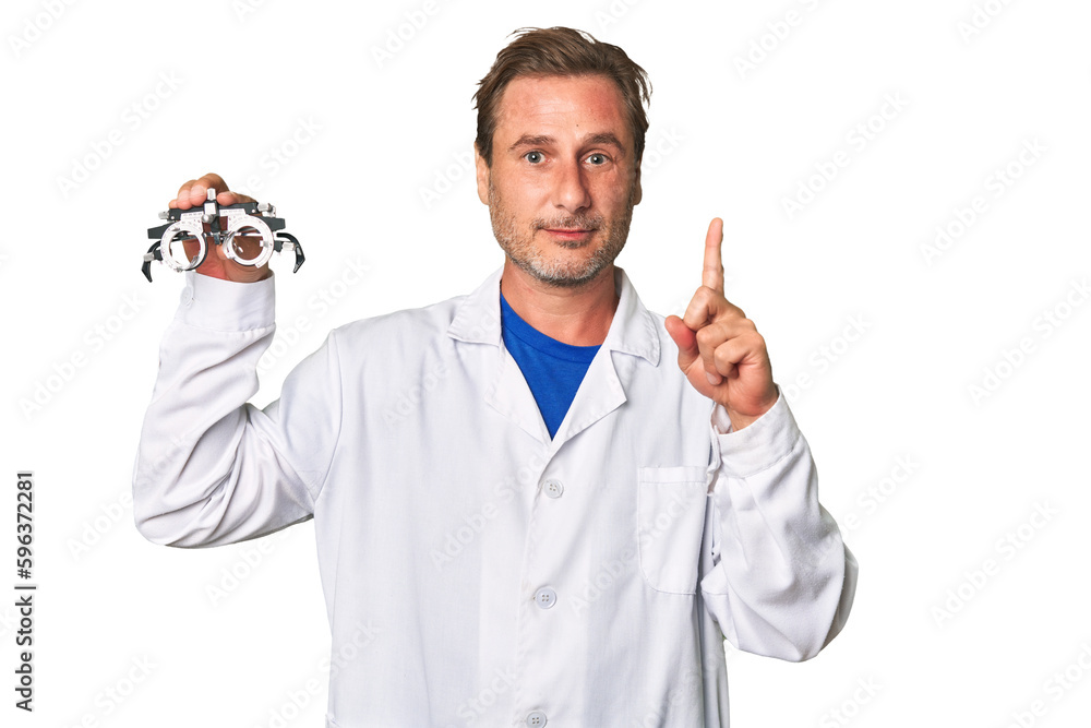A middle-aged optometrist man showing number one with finger. A middle-aged optometrist man showing number one with finger.