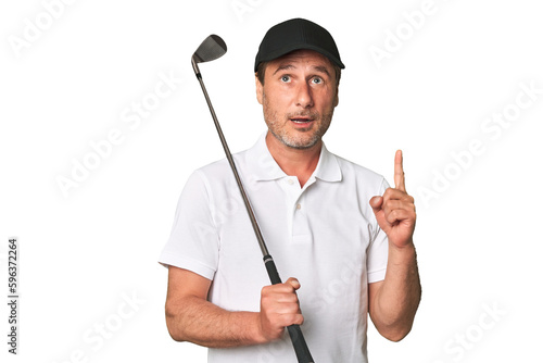 Middle aged golfer man pointing upside with opened mouth.