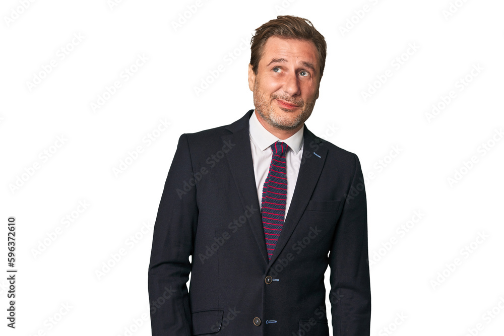 A middle-aged businessman isolated dreaming of achieving goals and purposes A middle-aged businessman isolated dreaming of achieving goals and purposes
