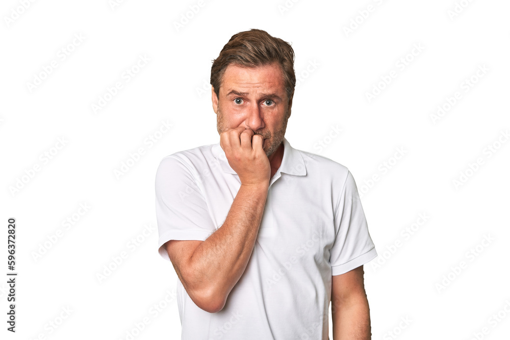 A middle-aged man isolated biting fingernails, nervous and very anxious. A middle-aged man isolated biting fingernails, nervous and very anxious.