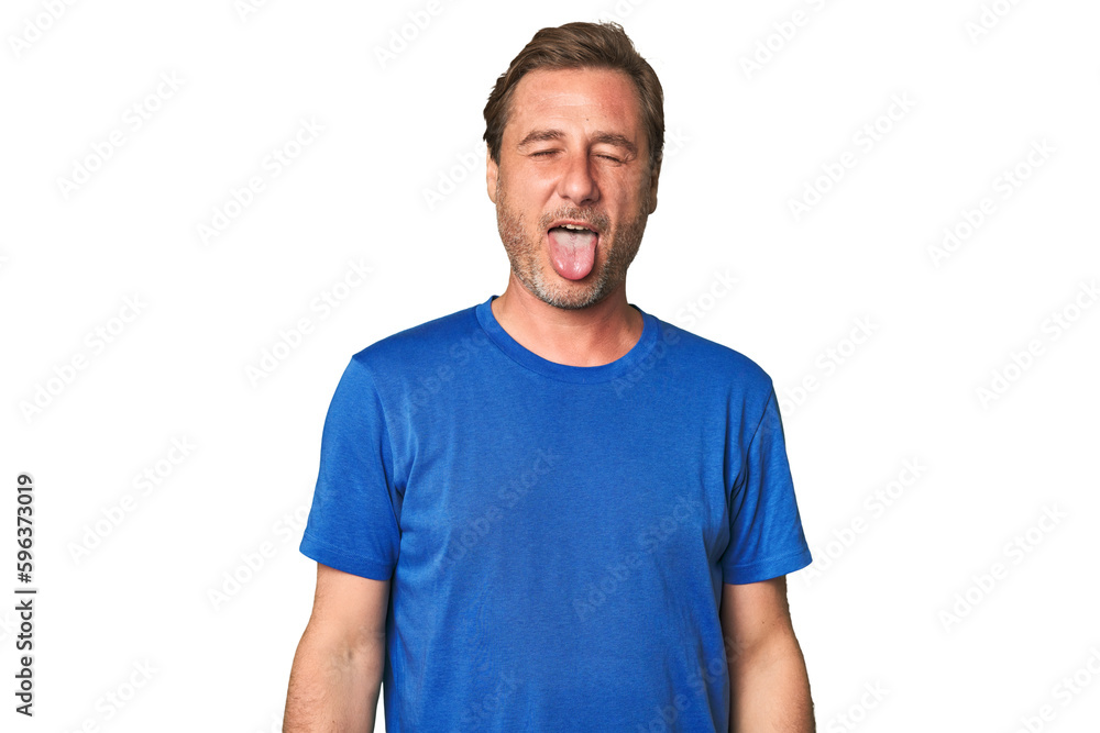A middle-aged man isolated funny and friendly sticking out tongue. A middle-aged man isolated funny and friendly sticking out tongue.