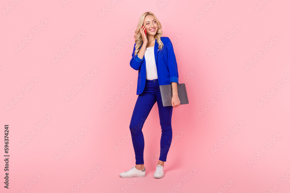 Photo of amazing business lady hold netbook speak over telephone partner wear smart casual outfit isolated pink color background