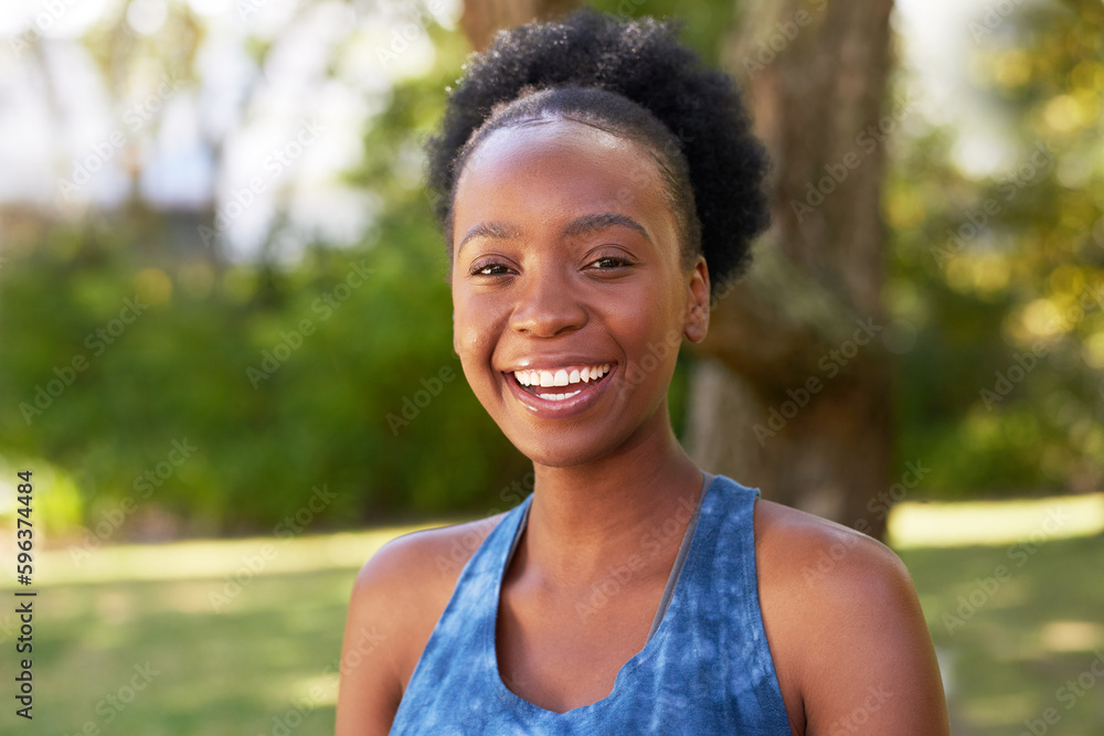 Portrait of beautiful Black woman smiling in park, trees and lawn Portrait of beautiful Black woman smiling in park, trees and lawn