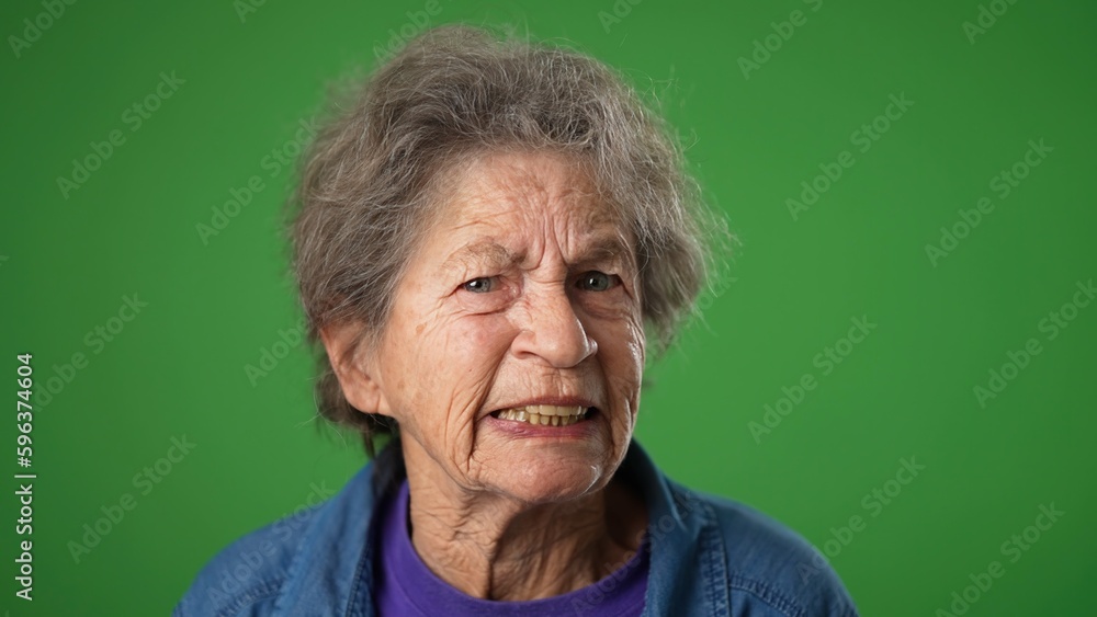 Frustrated angry with despair upset hands raised in air closeup portrait of elderly mature old woman 80s isolated on green screen background. Frustrated angry with despair upset hands raised in air closeup portrait of elderly mature old woman 80s isolated on green screen background.