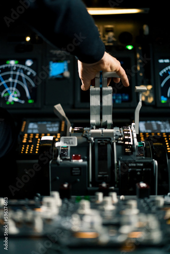 An airplane pilot controls the throttle during flight or takeoff View from inside the cabin