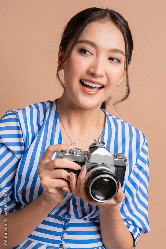 attractive asian female traveller woman enjoy photograph casual lifestyle,woman hold camera taking photo while travel carefree relax vacation, woman travel with happiness cheerful studio shot attractive asian female traveller woman enjoy photograph casual lifestyle,woman hold camera taking photo while travel carefree relax vacation, woman travel with happiness cheerful studio shot