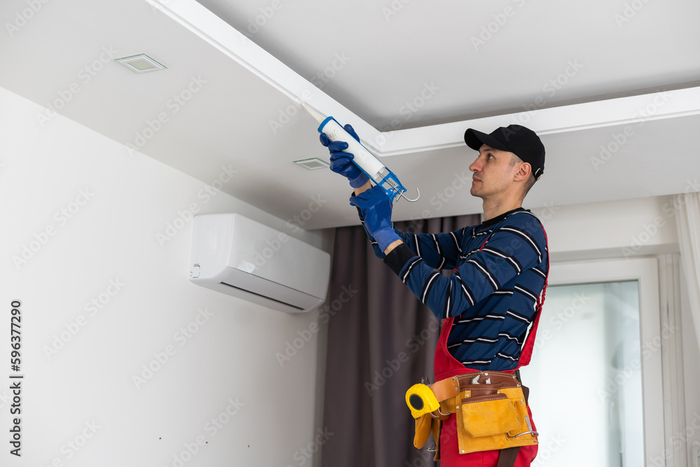 Construction worker ceiling work. working on repairs