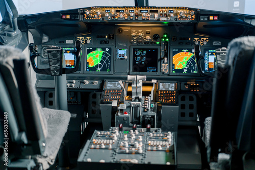 Empty airplane cockpit or flight deck modern passenger plane ready to fly flight simulator