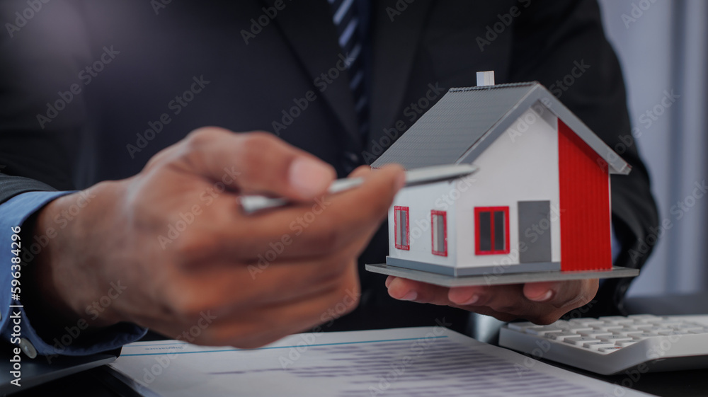 Real estate brokers are shaking hands to congratulate buyers after agreeing to insure and buy a house project. , Home Insurance Ideas home and land mortgage Real estate brokers are shaking hands to congratulate buyers after agreeing to insure and buy a house project. , Home Insurance Ideas home and land mortgage
