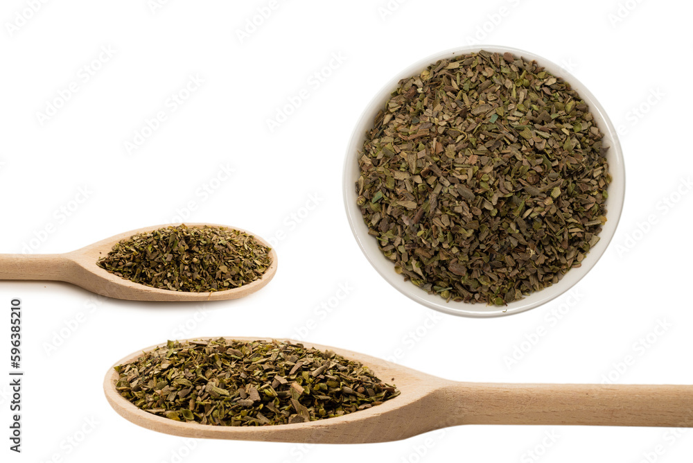 Oregano spice in wooden spoon isolated. Oregano spice in wooden spoon isolated.