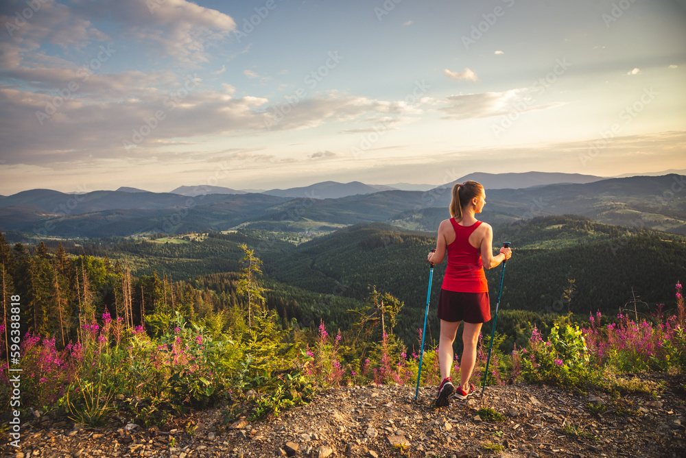 Young woman n the top of the mountains