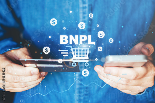 BNPL-Buy Now Pay Later shopping online icon , Online banking businessman using smartphone holding credit card online shopping concept.