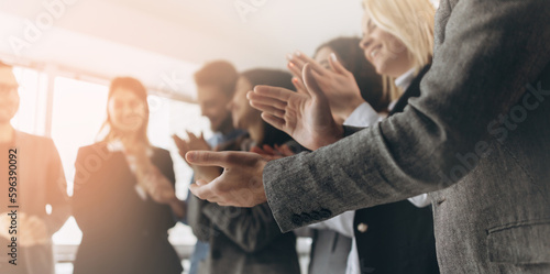Multiracial group of business people clapping hands to congratulate their boss - Business company team, standing ovation after a successful meeting
