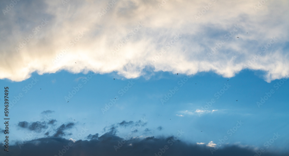 Beautiful bright orange sunset sky with clouds. Sunset sky with clouds background. Beautiful bright orange sunset sky with clouds. Sunset sky with clouds background.