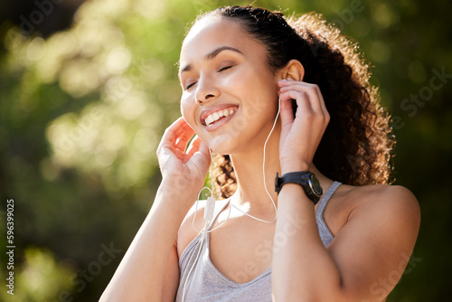 Music wont break your heart. Shot of a young woman listening to music during a workout.