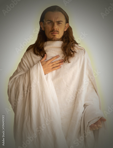Christ-like man with hand on his heart