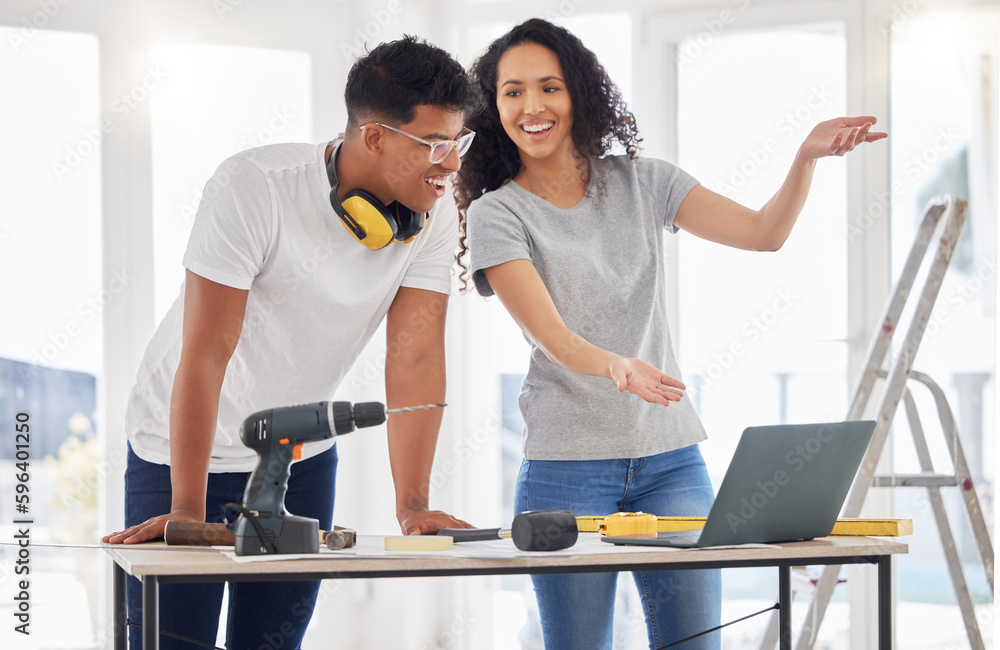 With the help of the internet, anyone can be an expert. Shot of a young couple using a laptop while busy renovating a house. With the help of the internet, anyone can be an expert. Shot of a young couple using a laptop while busy renovating a house.
