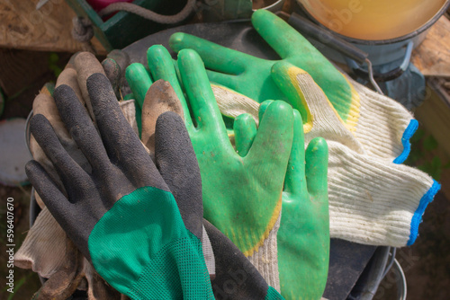 Different pairs of work gloves lying together
