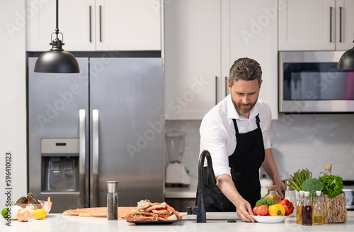 man cooking healthy food  banner. man cooking healthy food wearing apron.