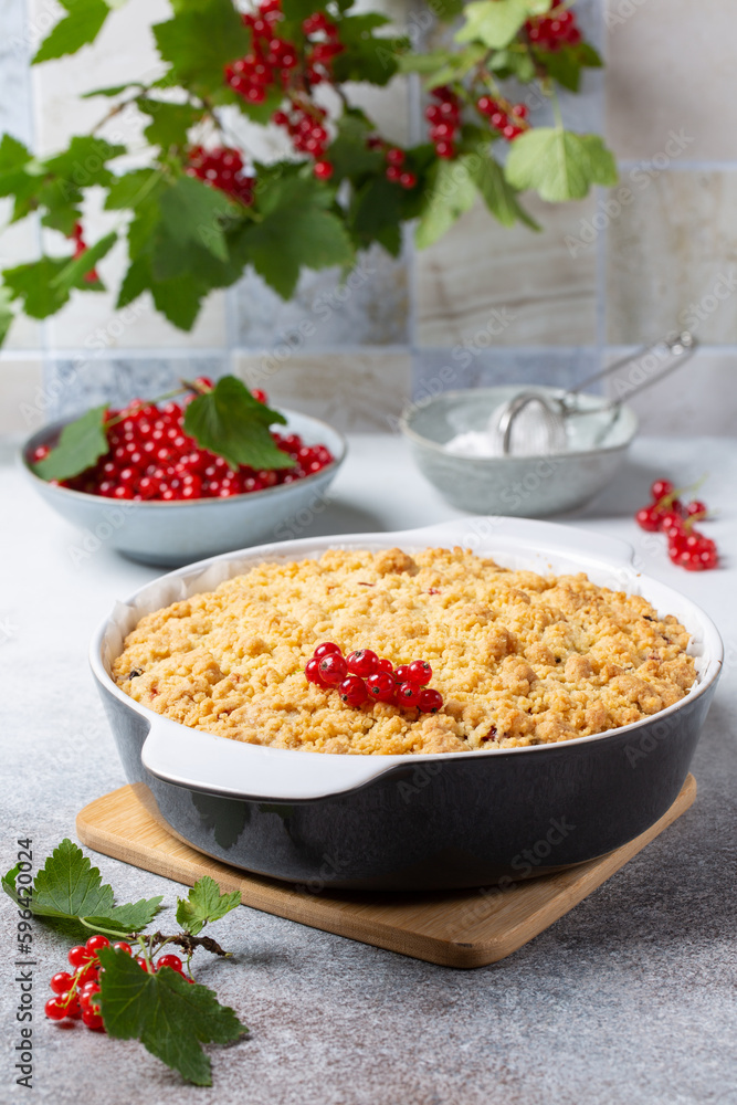 Homemade cake with berries on gray background. Yogurt pie with fresh red currant. Homemade cake with berries on gray background. Yogurt pie with fresh red currant.