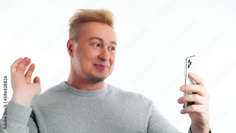 Selfie, pose and man with phone, peace sign for social media post. Positive guy with mobile smartphone posing smiling, taking profile picture, studio shot isolated on white background Selfie, pose and man with phone, peace sign for social media post. Positive guy with mobile smartphone posing smiling, taking profile picture, studio shot isolated on white background